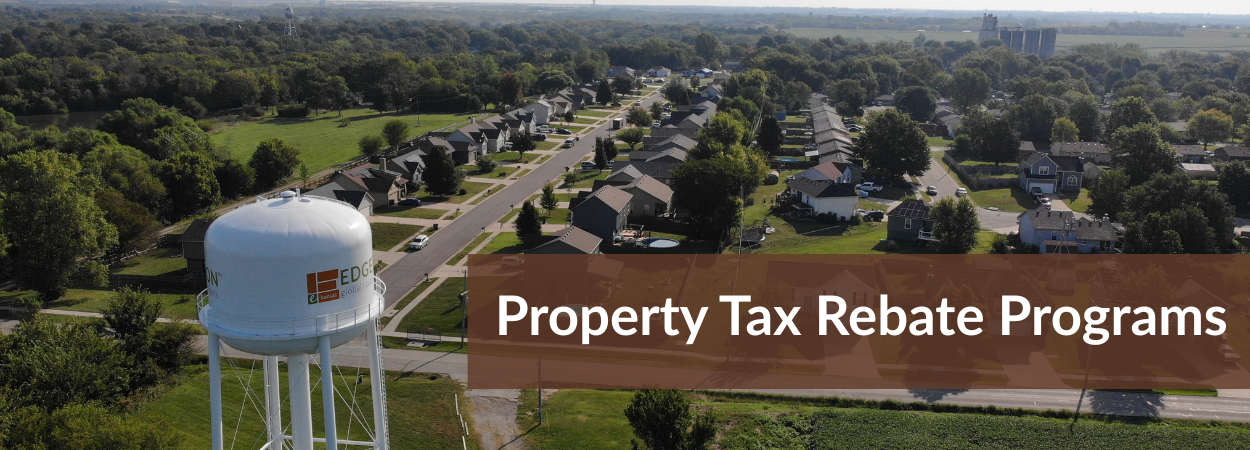 A drone shot of west Edgerton with the water tower in the foreground. The words Property Tax Rebate Programs