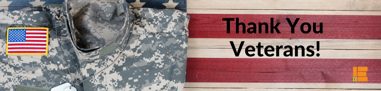 Military fatigues folded on a wooden flag with the words "Thank You Veterans" and the Edgerton "E" logo in the corner